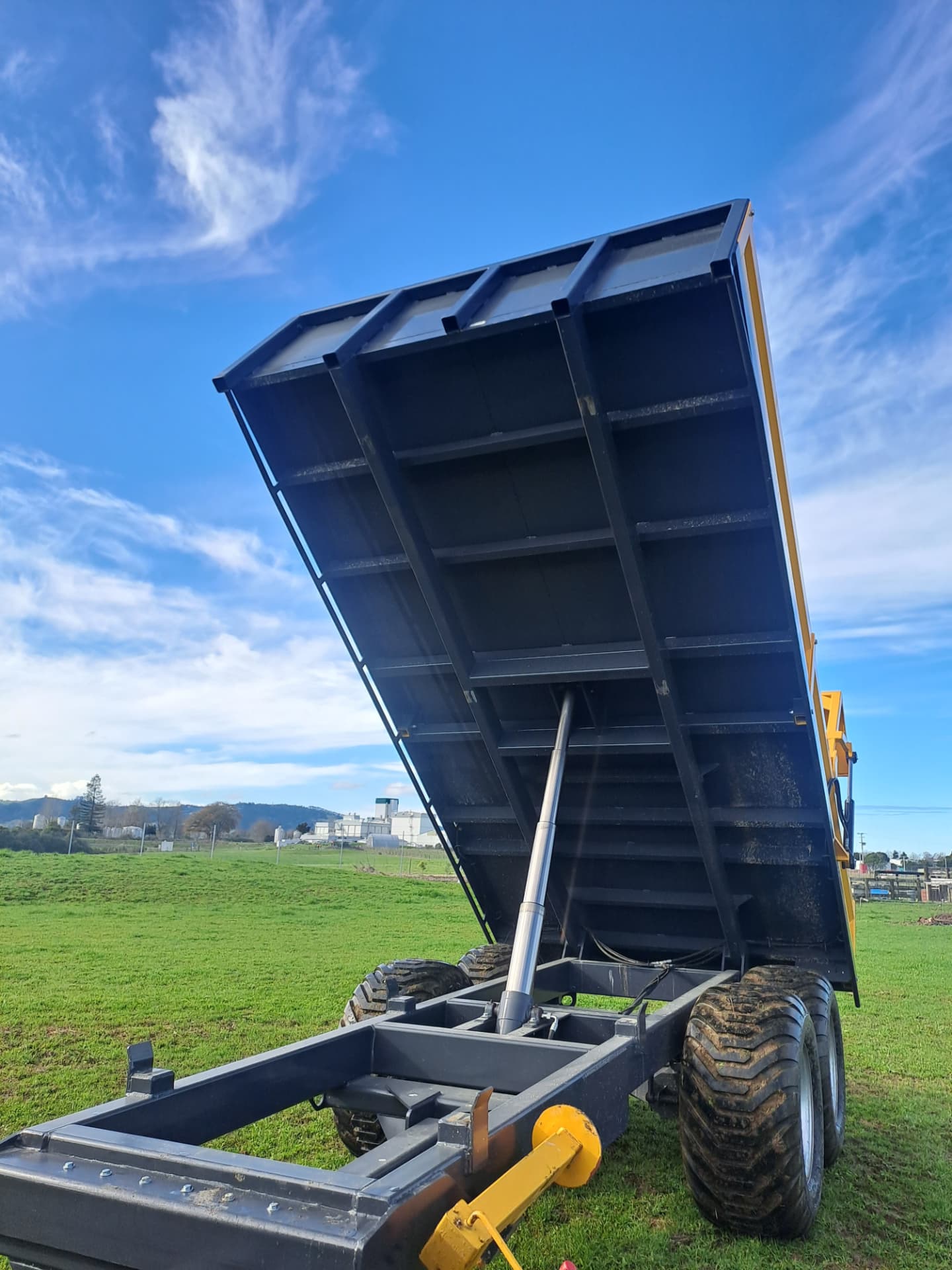 Underside of a raised Maxi tip trailer deck showing the strong frame and ram